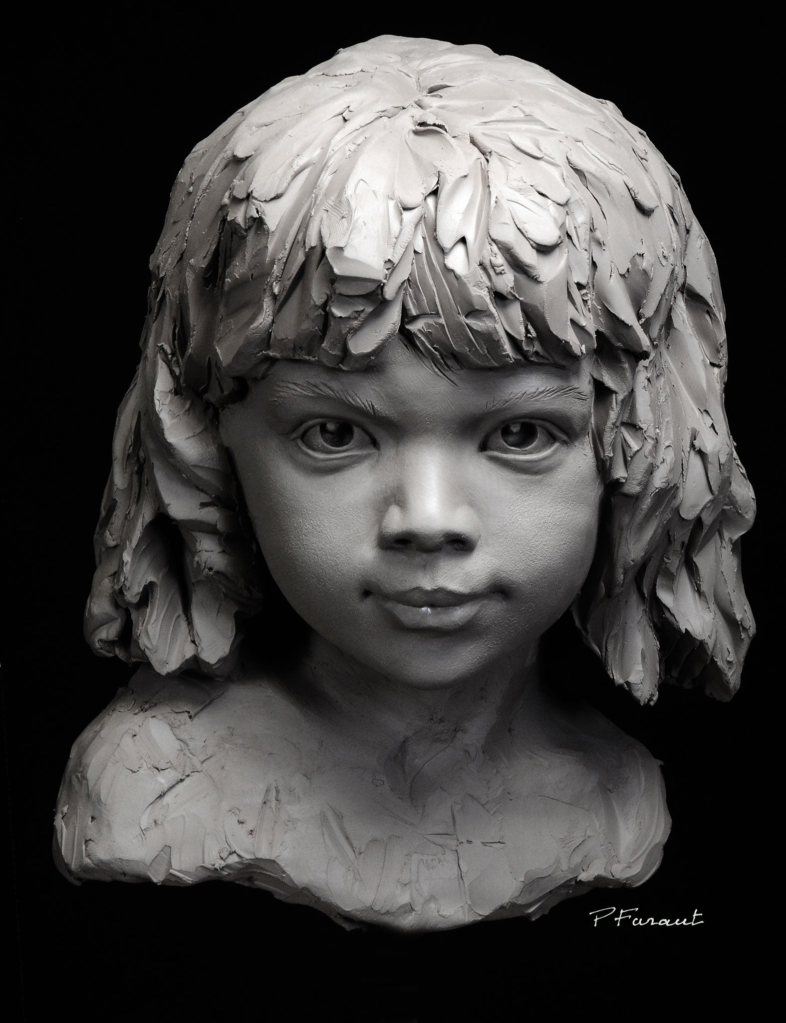 Stylized clay portrait sculpture of a little girl by artist Philippe Faraut