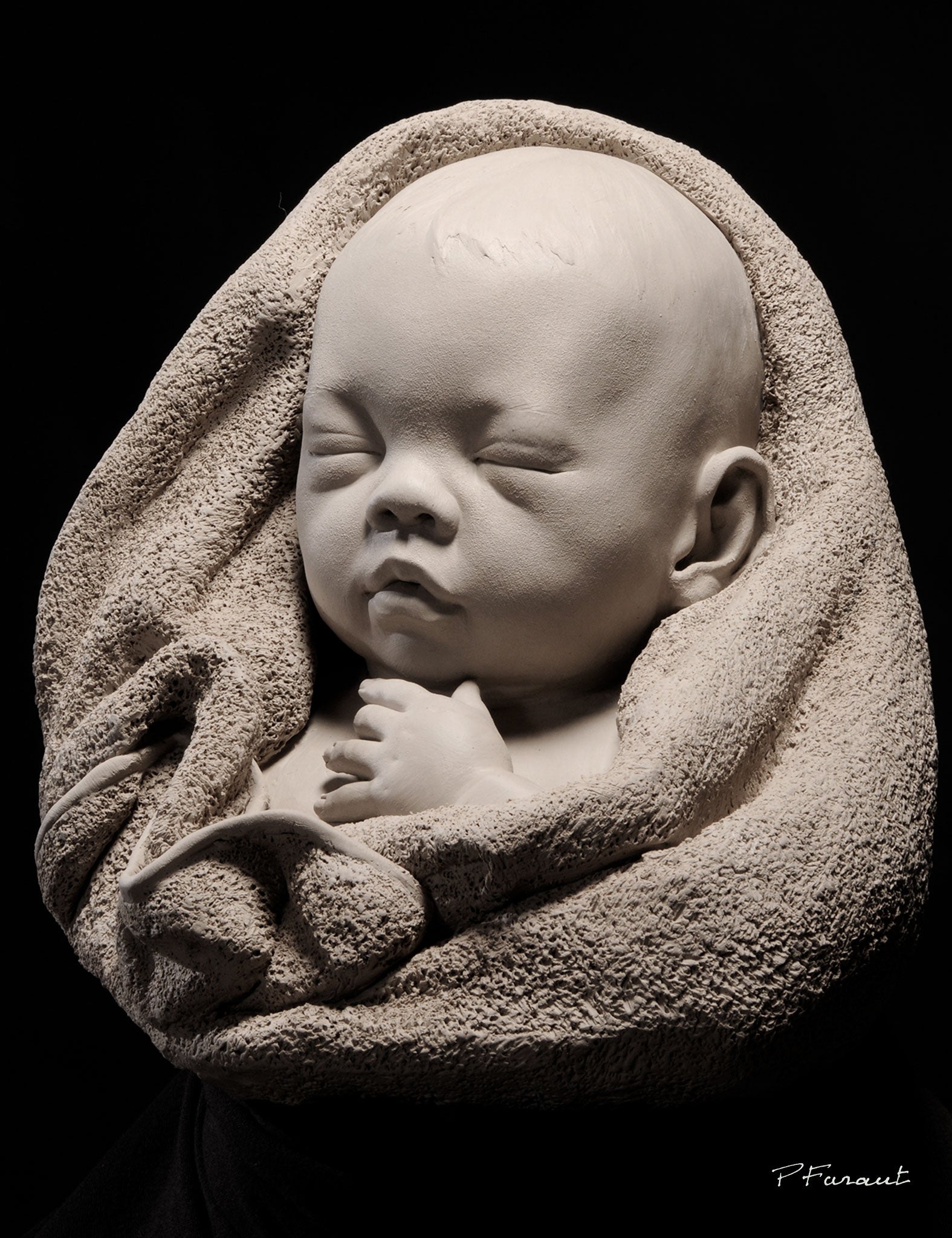 portrait sculpture of sleeping baby wrapped in terry cloth towel by Phlippe Faraut
